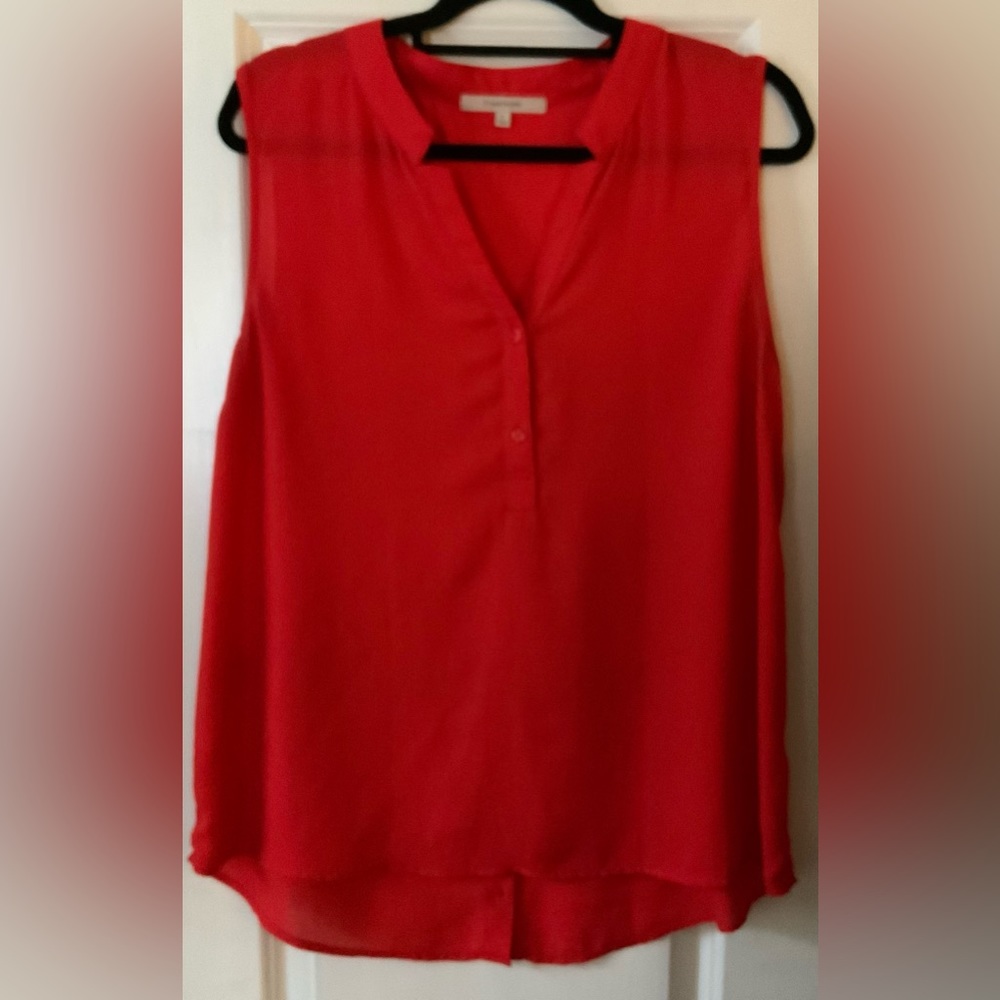Orange/red sleeveless blouse